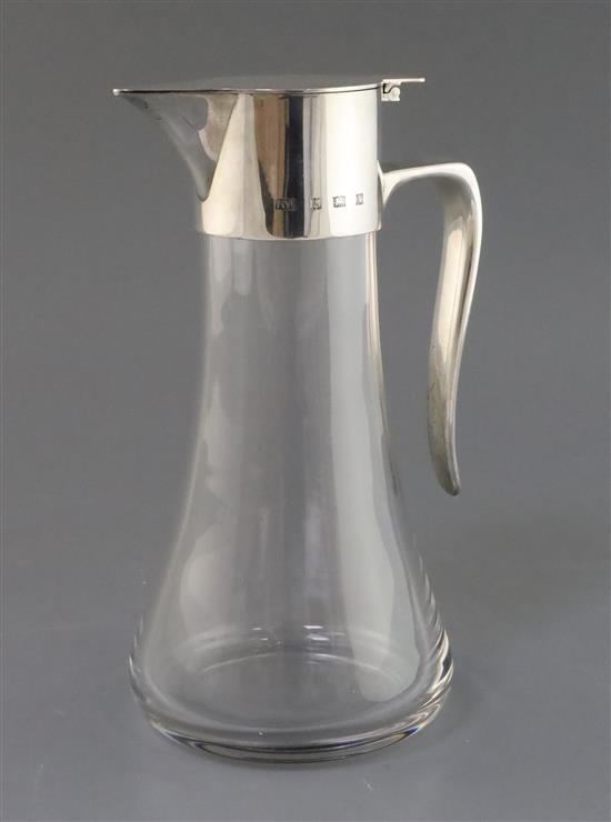 A silver-mounted glass claret jug of tapered form, Birmingham 1972, maker Robert Welch, 25cm.